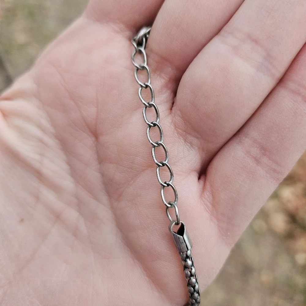 long silver tone chain necklace with articulated owl pendant
